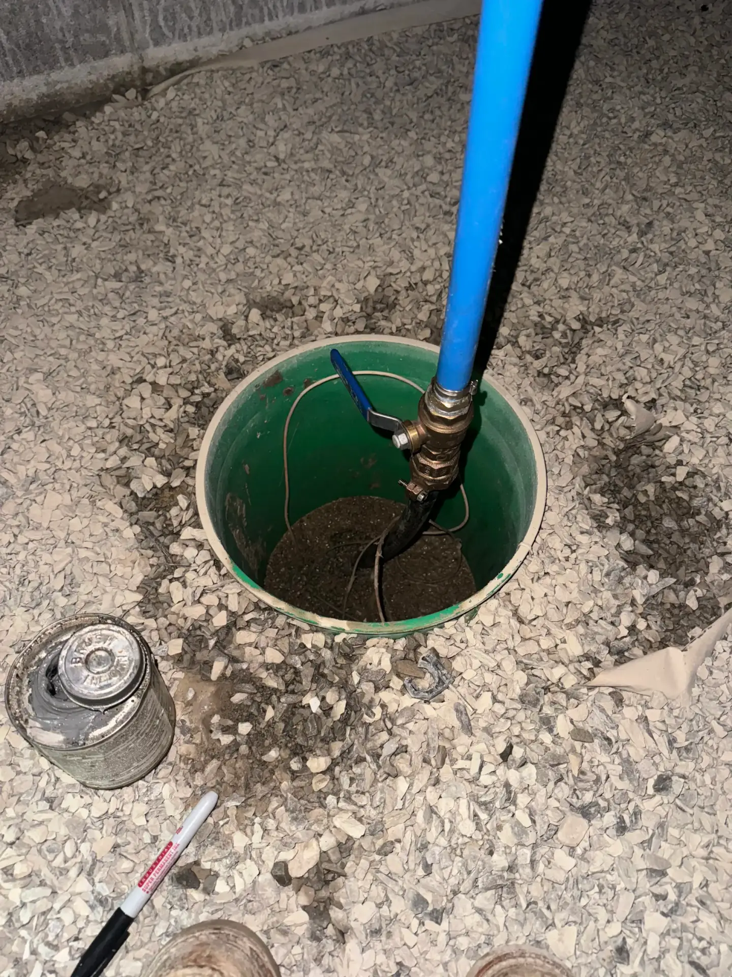 Water meter pit with shutoff valve and blue poly supply line